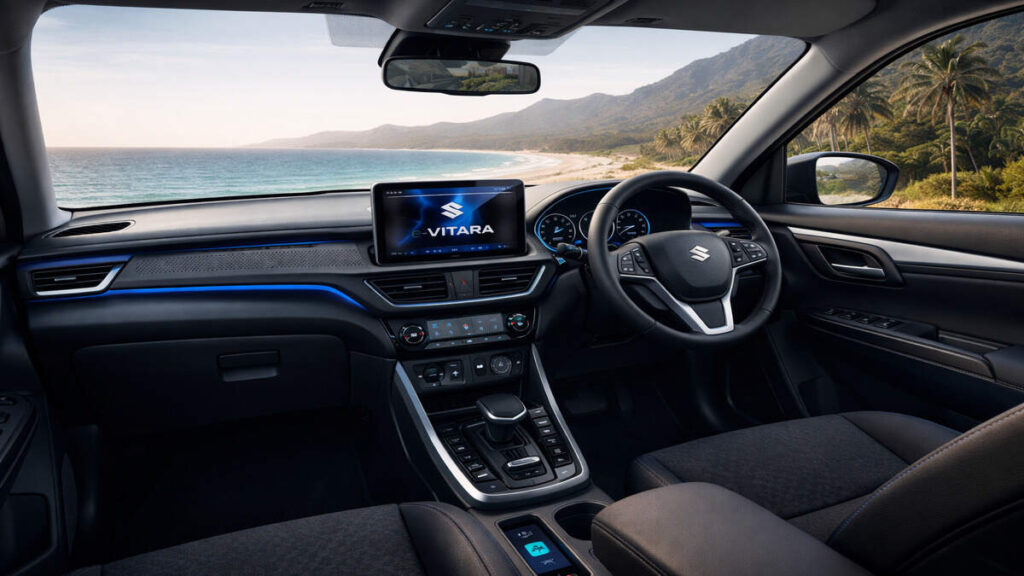 Maruti Suzuki e-Vitara electric SUV interior with dashboard, steering wheel and touchscreen, 16:9 realistic photo
