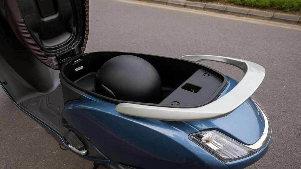 TVS Jupiter 125 under seat storage interior view in blue colour