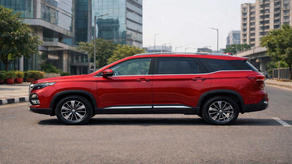 MG Hector Plus Glaze Red side profile on Indian city road